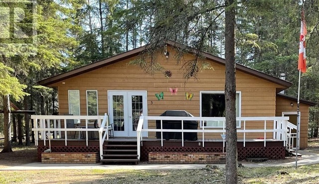 Privacy Galore! Enjoy this roomy year round lake home surrounded by the forest