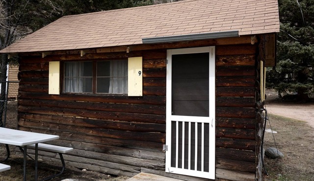 Simple Country Cabin with Ornate Wood Stove in the Colorado Mountains of Poudre Canyon