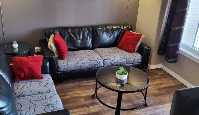 Spacious 4-bedroom townhome in charming Red Deer with WiFi, AC
