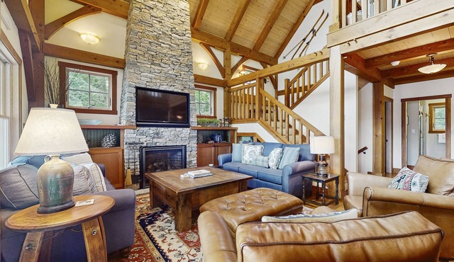 Spectacular lakefront home w/private dock, beach, swim platform, gazebo & porch