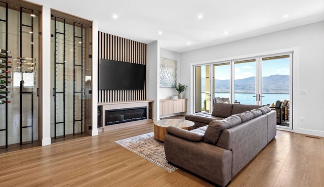 Stay in an elegant 4 bedroom estate in the prestigious Lakeview Heights. Featuring 2 king beds, 2 queen beds, sofa bed, 5 bathrooms, hot tub, movie room & patio with lake & mountain views. Close to wineries, beaches & downtown Kelowna.