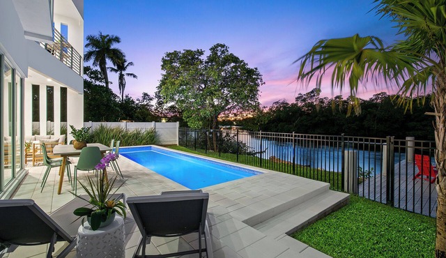 Stunning Modern Heated Pool Retreat with Scenic Waterway Views Near Beaches!