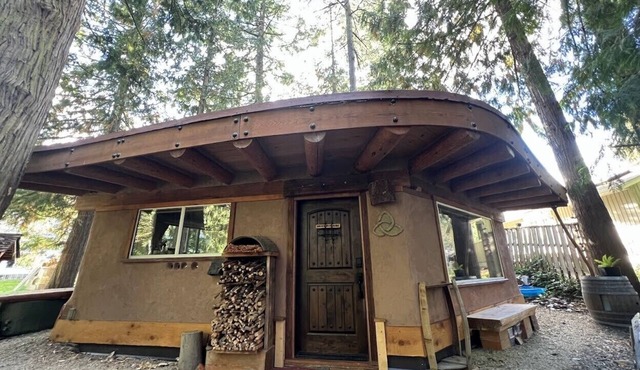 The Wobbly Hobbit- a unique earthen cabin in the woods.