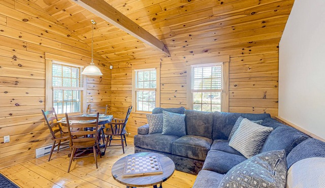 Two log cabins on 5 acres with patios, grill, firepit, outdoor games, & W/D