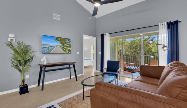 Updated modern 3rd floor Lely Resort condo overlooking tropical preserve!