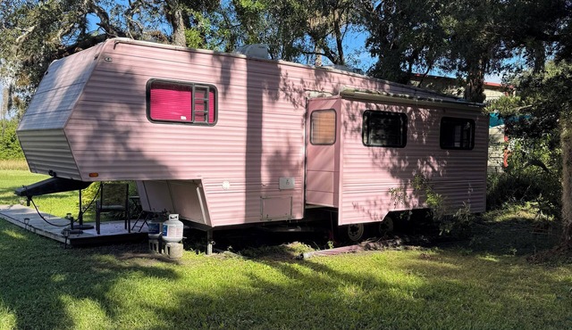 Welcome to the pink, cozy camper, minutes to the beach. The best of both worlds.